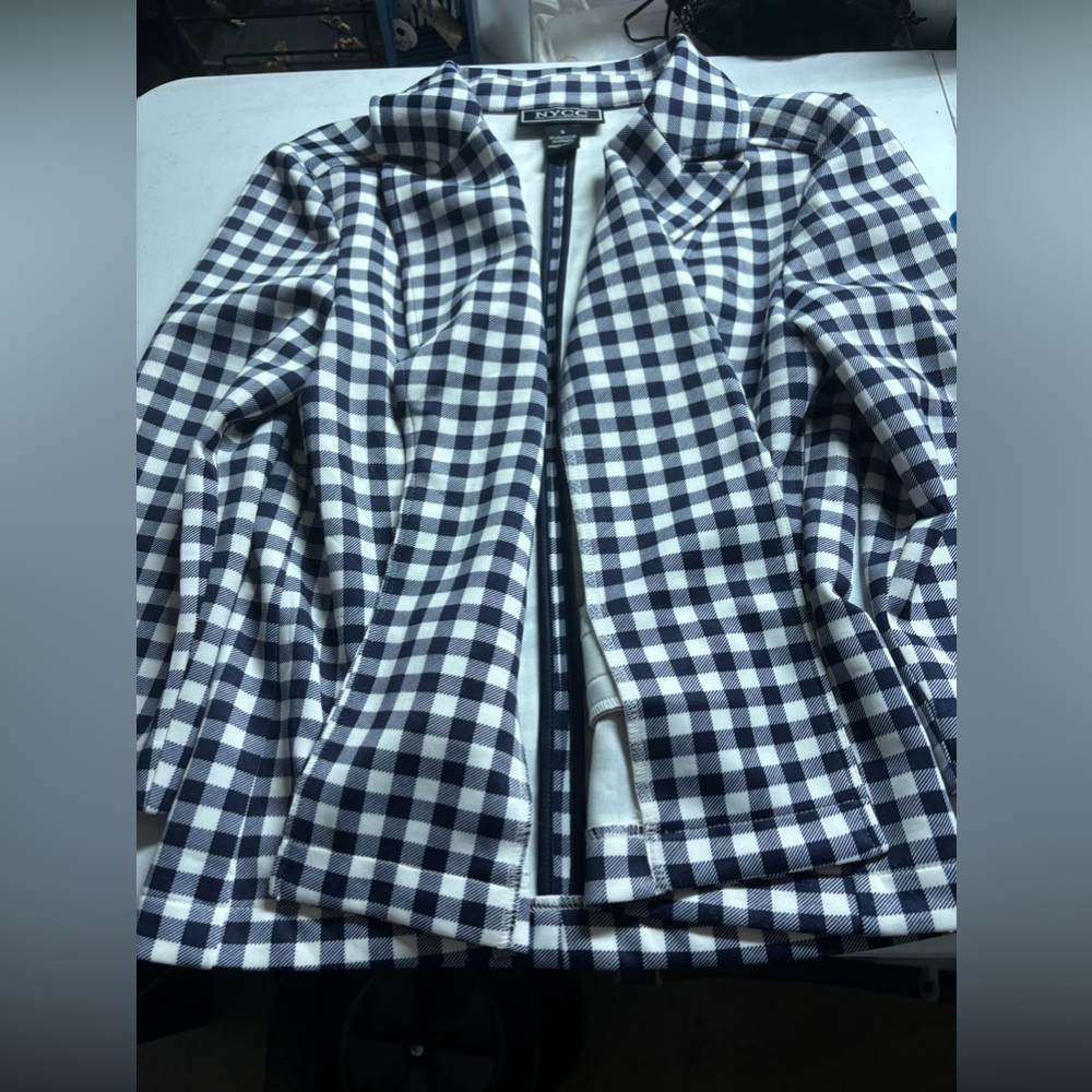 A plaid black and white blazer